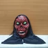 Kép 5/6 - Zombi maszk sötétben világító szemű Halloween jelmez kiegészítő, PIROS